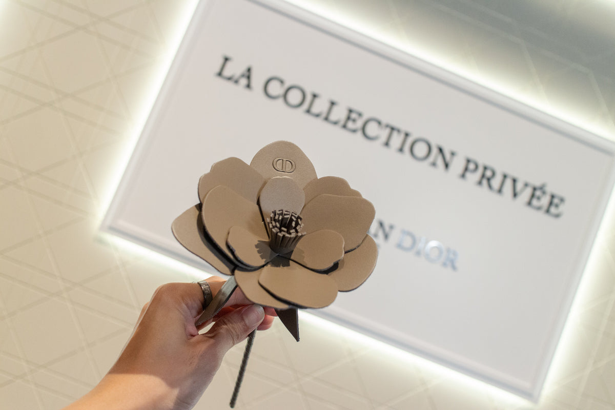 Flower made out of leather with Dior logo for LA Collection Privee Cuir Saddle Fragrance Launch 
